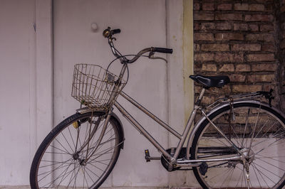 Bicycle leaning against wall