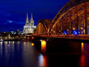 Hohenzollern bridge over rhine river by cologne cathedral in city