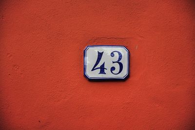 Close-up of information sign on wall