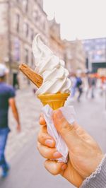 Hand holding ice cream cone