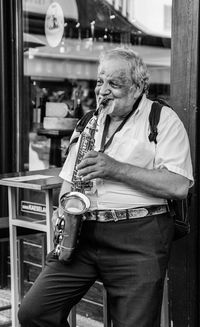 Senior man playing saxophone