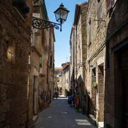 Narrow street amidst buildings in city