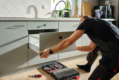 Midsection of man working in office