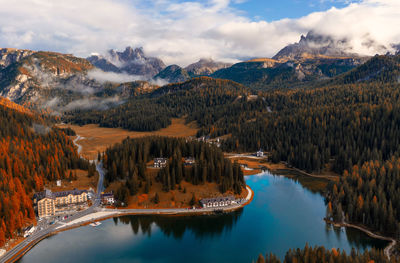 Scenic view of lake and mountains against sky