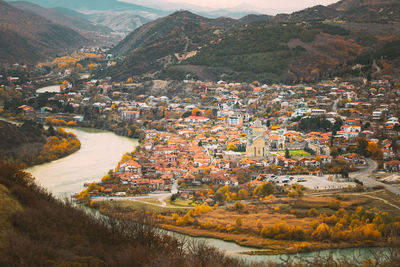 High angle view of townscape by lake