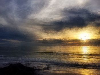 Scenic view of sea against dramatic sky