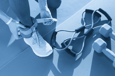 Low section of woman wearing shoes