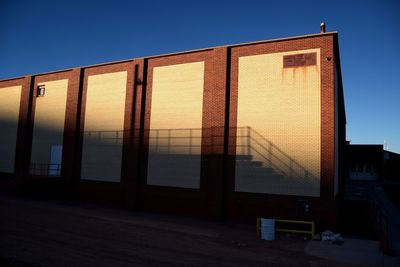 Exterior of building against clear sky at sunset