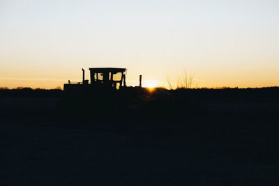 Silhouette landscape against sky during sunset