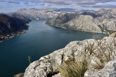 Scenic view of lake and mountains against sky