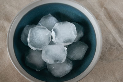 High angle view of blueberries in bowl on table