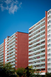 Low angle view of buildings against blue sky