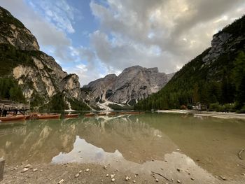 Scenic view of lake and mountains against sky