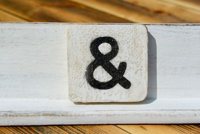 High angle view of symbol on wooden table