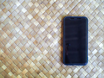 High angle view of mobile phone on table