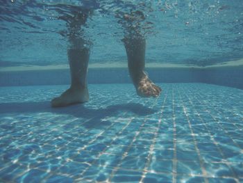 Low section of woman in swimming pool