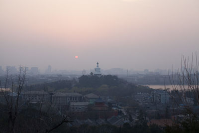 View of cityscape at sunset