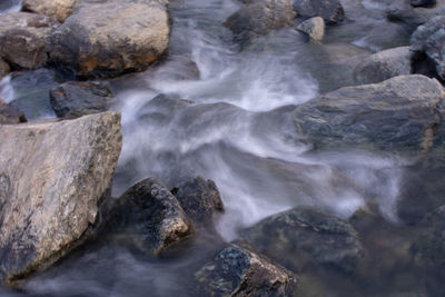 Water flowing through rocks in sea