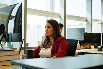 Woman working on a computer in the office