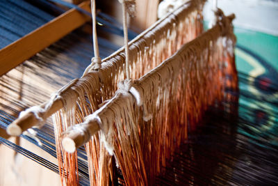 Close-up of threads on loom 