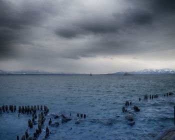 Scenic view of sea against sky during winter