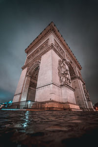 Low angle view of illuminated building against sky