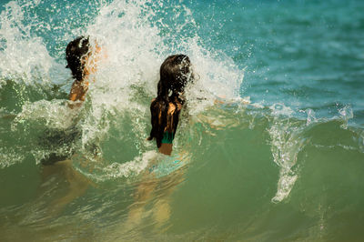 Woman swimming in sea