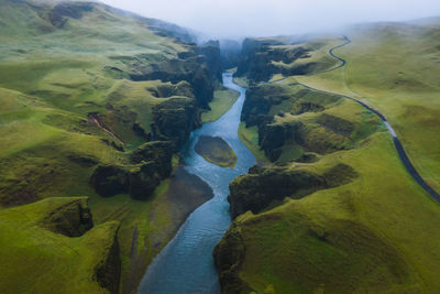 High angle view of river flowing through landscape