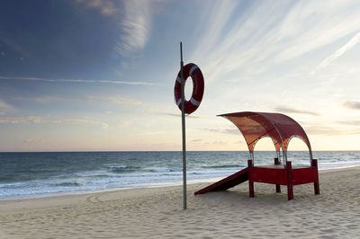 View of calm beach against sky