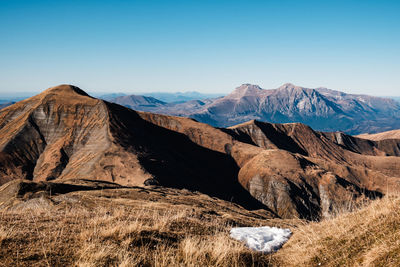 Scenic view of snowcapped mountains against clear sky in amatrice, lazio italy 