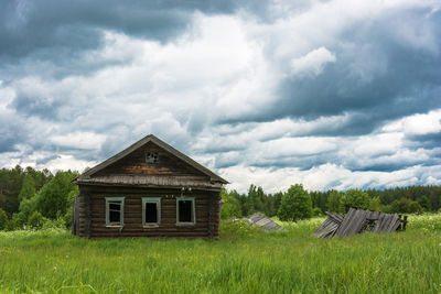 House on field against sky