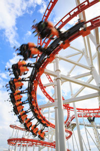 Low angle view of ferris wheel against sky