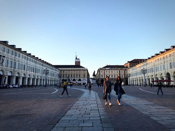 Group of people in front of historical building