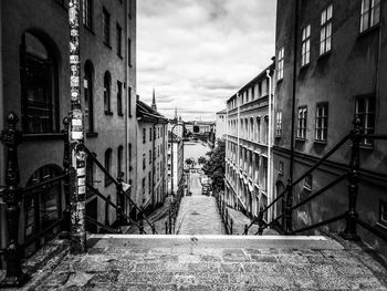 Narrow street amidst buildings against sky