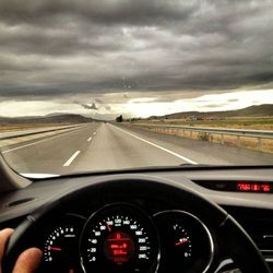 View of highway through car windshield