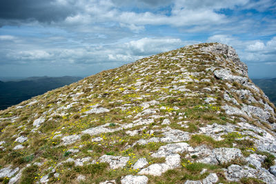 Low angle view of rock formation against sky