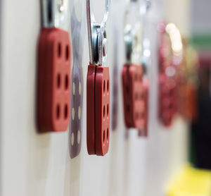 Close-up of electric lamp hanging on wall