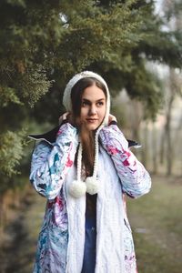 Portrait of smiling young woman in park