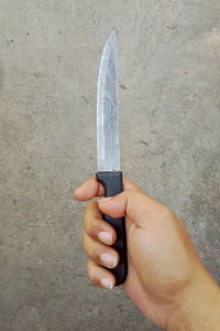 Close-up of person holding umbrella