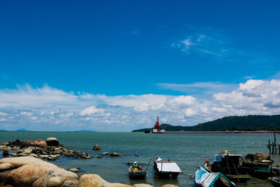 Scenic view of sea against blue sky