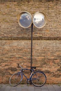 Bicycle against brick wall