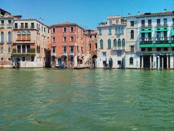 View of buildings against blue sky