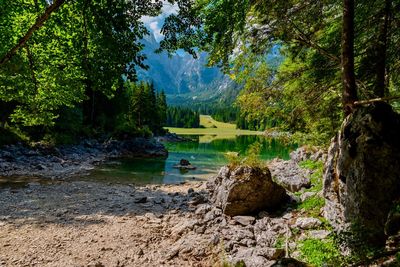 Scenic view of lake and mountains against sky