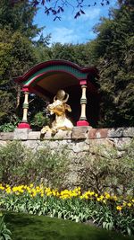 View of dog statue against plants