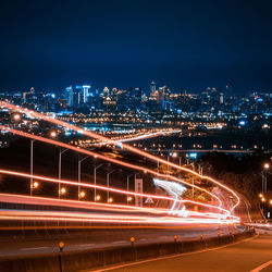 High angle view of light trails on road at night