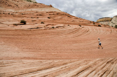 Scenic view of arid landscape against sky