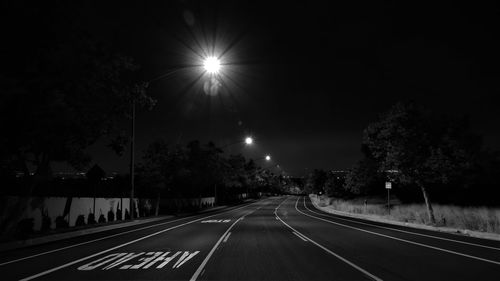 View of illuminated street at night