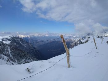Scenic view of snowcapped mountains against sky