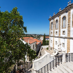 Houses in town against blue sky