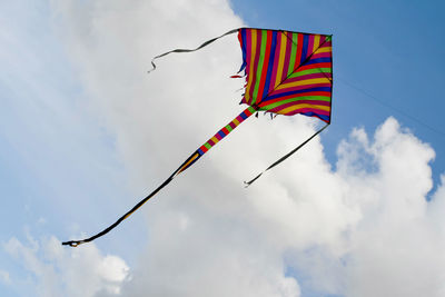 Low angle view of kite flying against sky